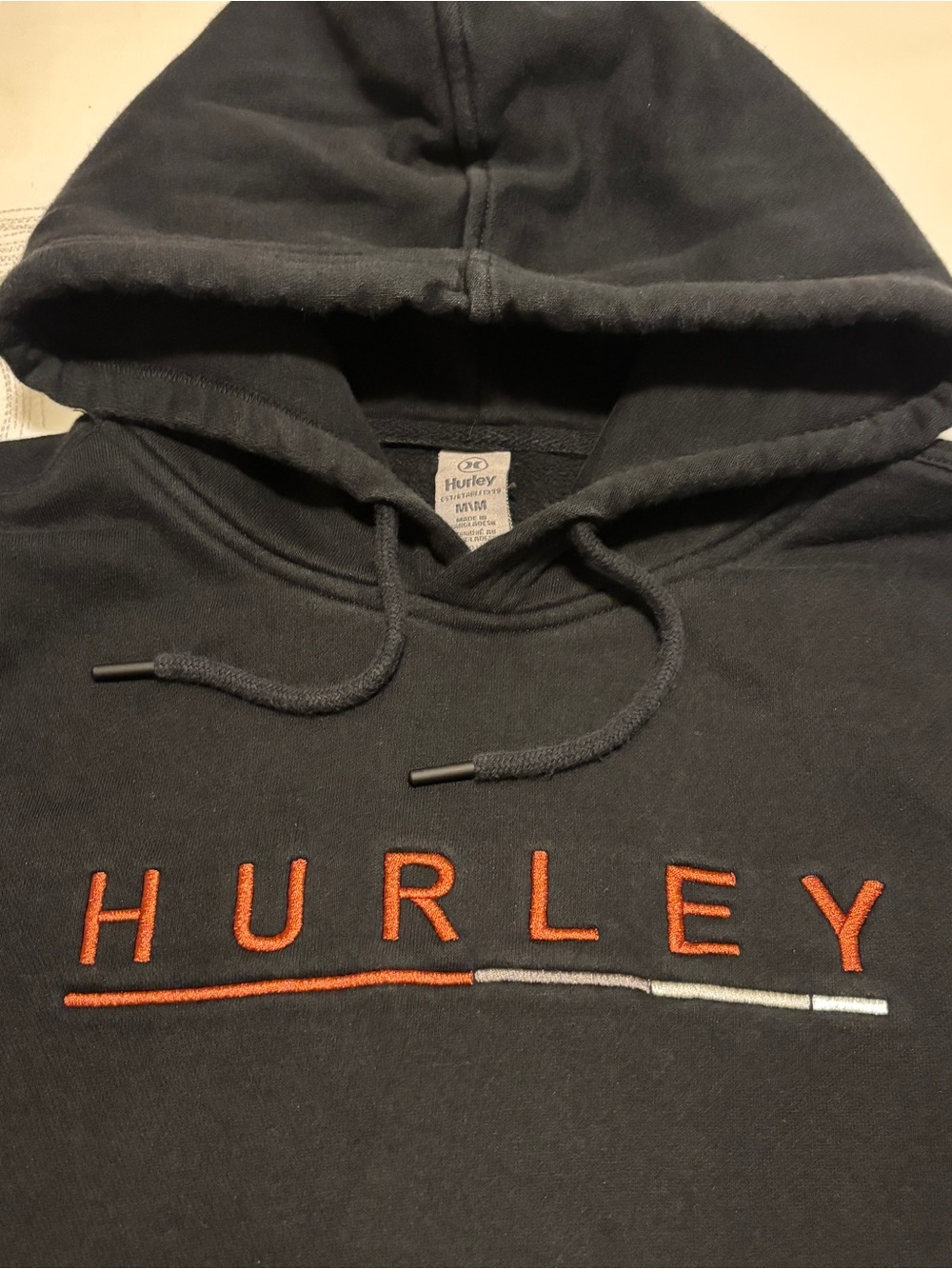 Hurley Black Zip-Up Hoodie with Orange Logo Accents